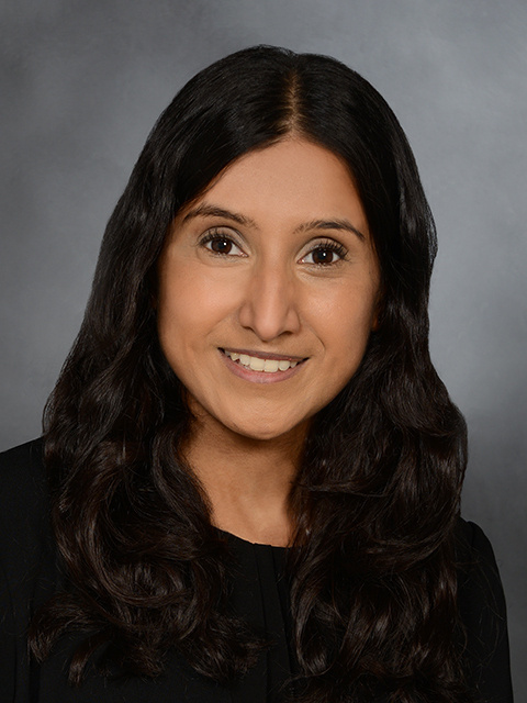 professional headshot of Dr. Kanduri. She is wearing a black shirt and has her hair tucked behind her back.