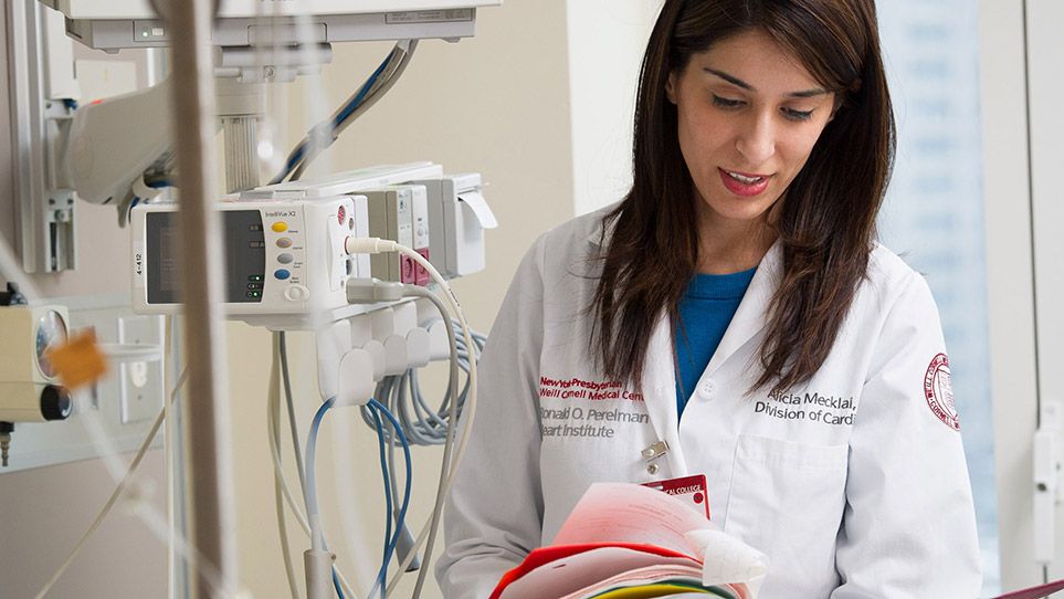 Dr. Mecklai analyzing patient chart