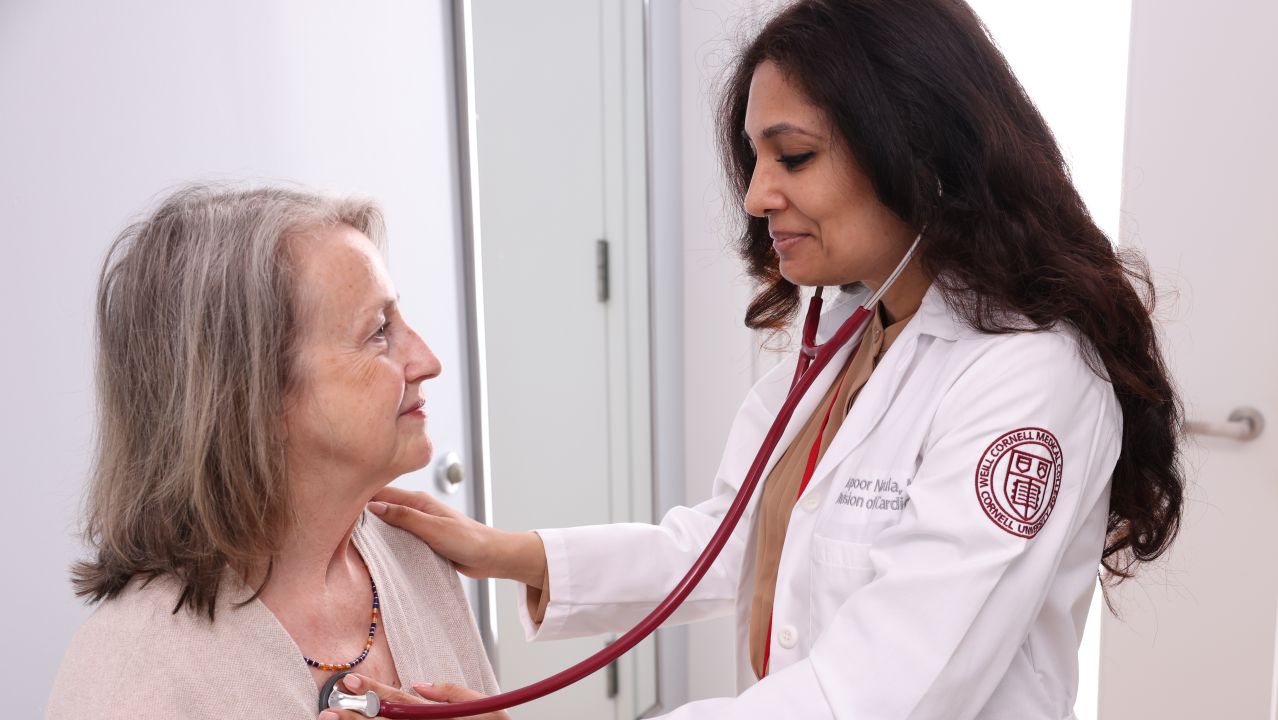 Dr. Narula listening to the heartbeat of a patient